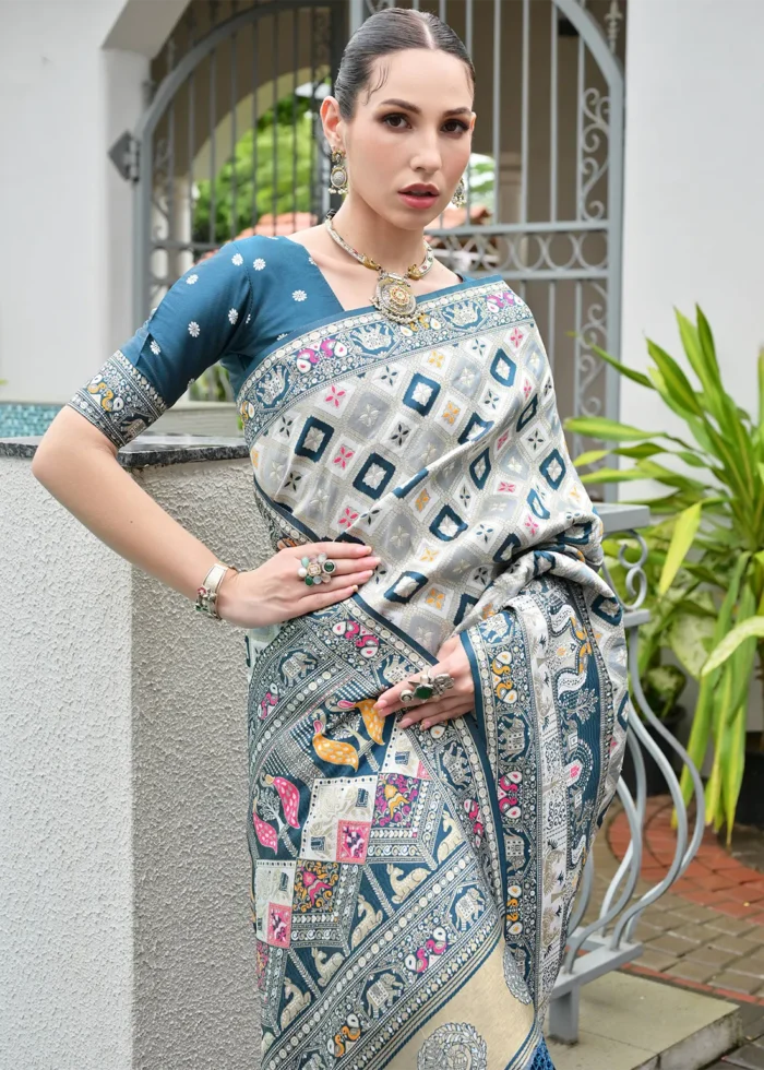 White and Teal Blue Patola Silk Saree with Floral Motifs
