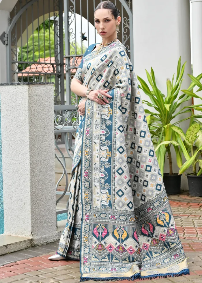 White and Teal Blue Patola Silk Saree with Floral Motifs