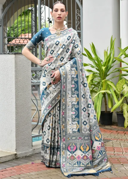 White and Teal Blue Patola Silk Saree with Floral Motifs